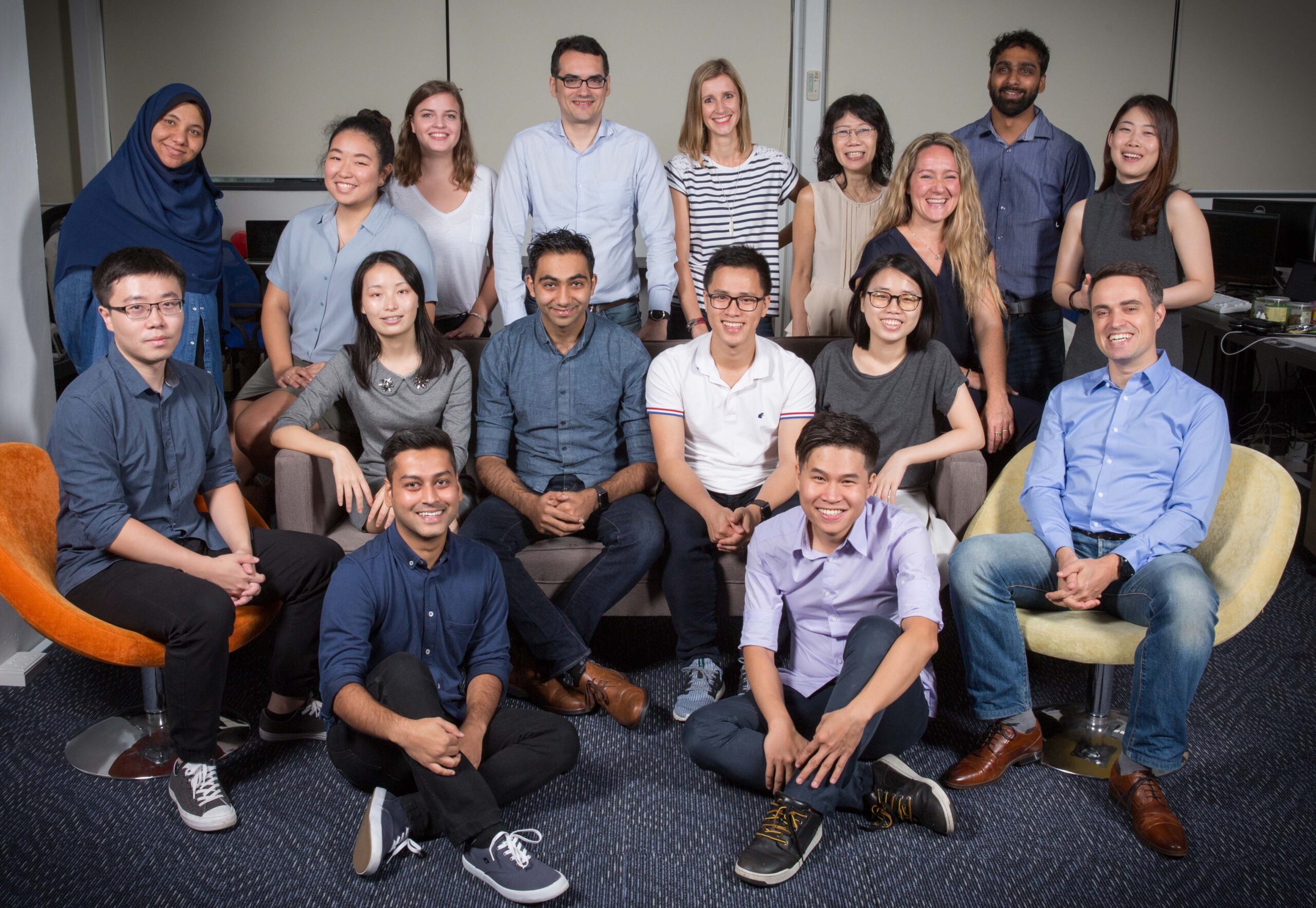 Tang Han (second row, second from left) with her team at Healint