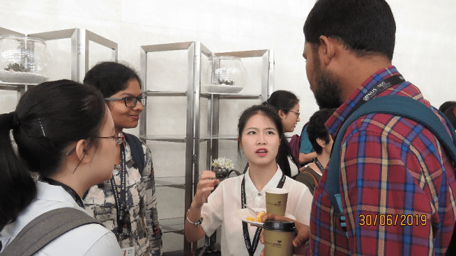 MSOM society members mingling over food and drinks during the Special Interest Group Meeting