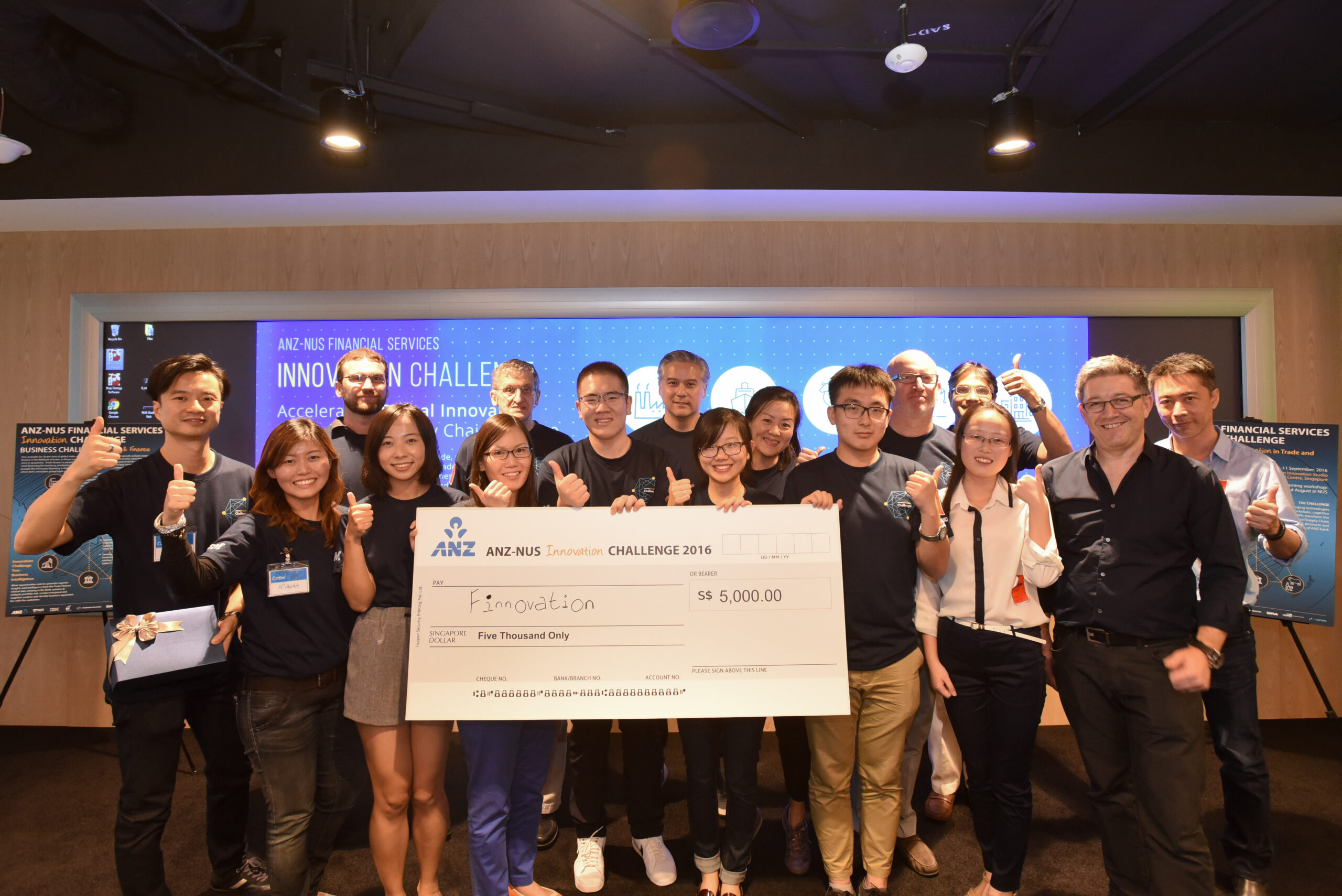 Event partners, including representatives from ANZ, IBM, NUS and Thomson Reuters pose with the winning students